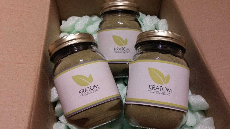 three jars of powdered kratom|Three jars of kratom powder in a box|kratom powder bag