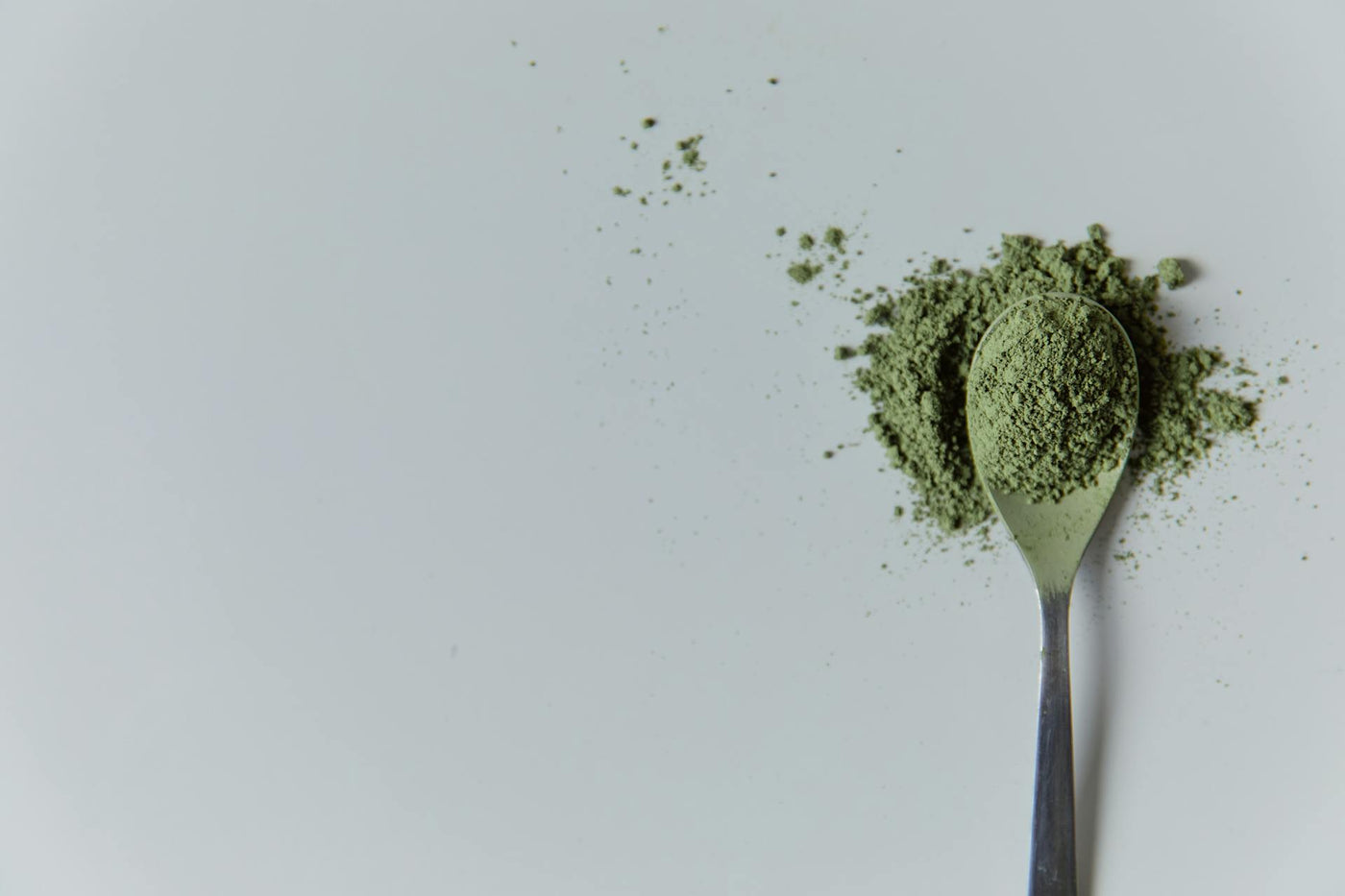 Kratom powder in a spoon|