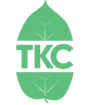 A drawing of a green leaf, split in the middle to make room for "TKC" in green lettering.