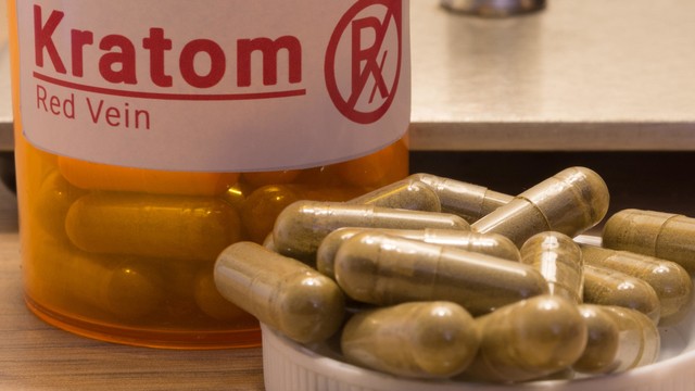 a close up look at red vein kratom capsules