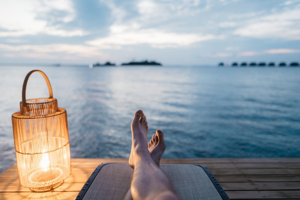 person relaxing on a dock