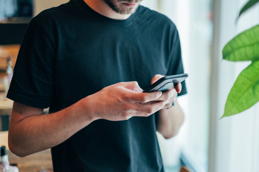 a man holding a phone