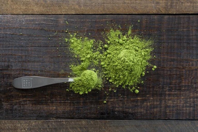 green powder on a wooden countertop