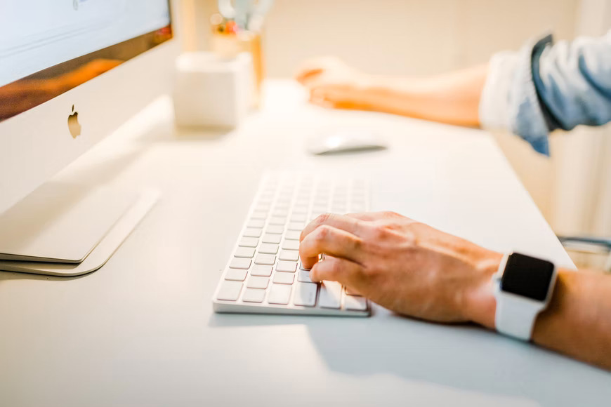 a person using an iMac