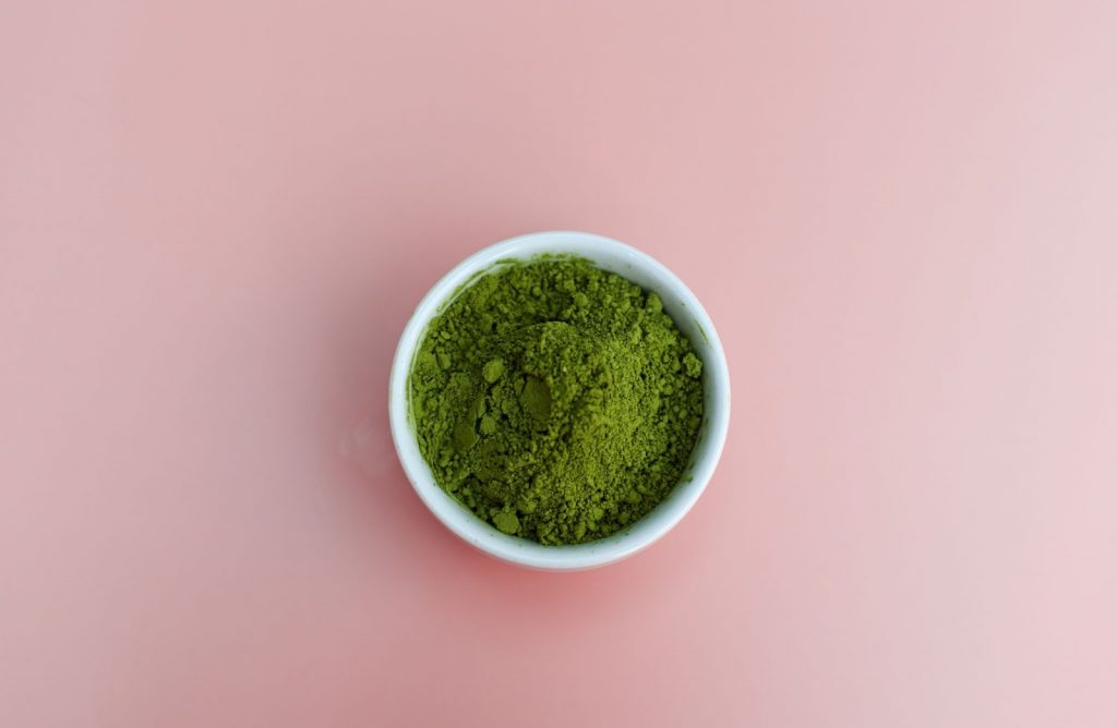 green powder in a white bowl