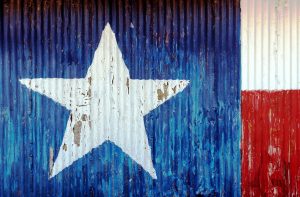 Texas flag painted over a barn wall