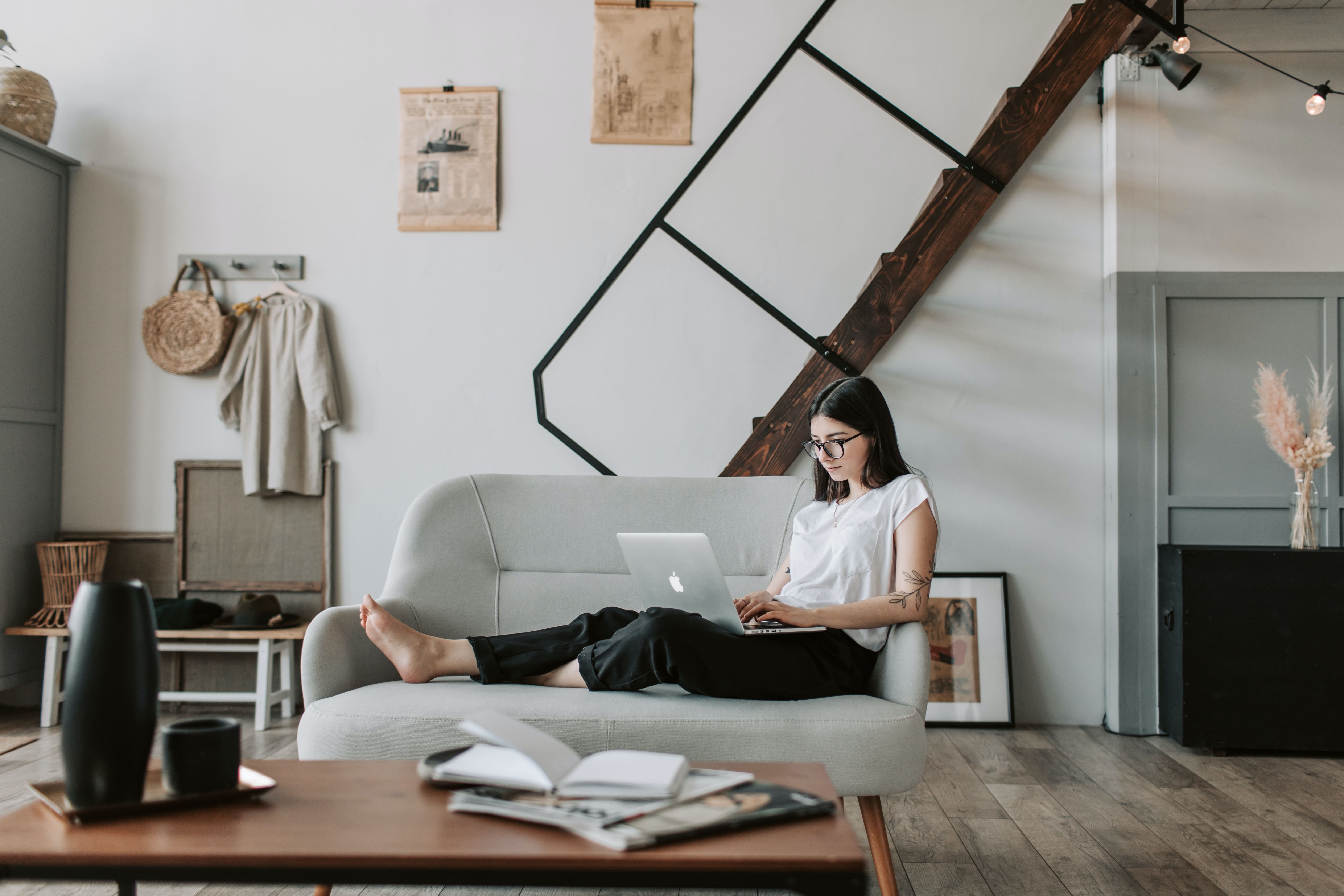 young woman using laptop in modern living room